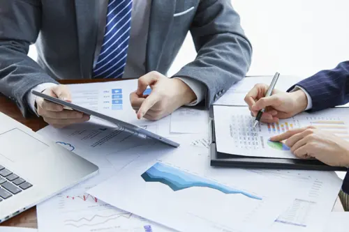 businessmen-elegant-suits-business-meeting-discussing-new-project-office-768x512