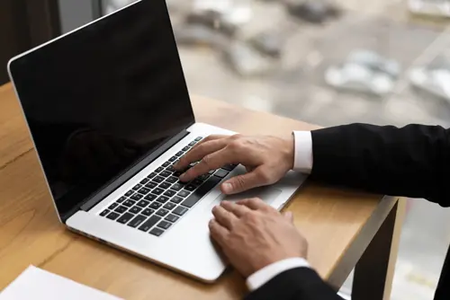 close-up-adult-working-his-laptop-office