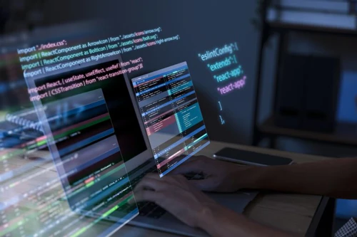 programming-background-with-person-working-with-codes-computer-768x512