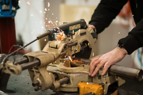 technician-worker-cutting-metal-with-many-sharp-sparks-using-equipments-cat-iron-768x512